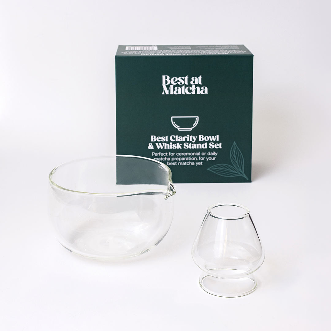 Clear glass bowl and whisk stand set with 'Best at Matcha' packaging on a white background