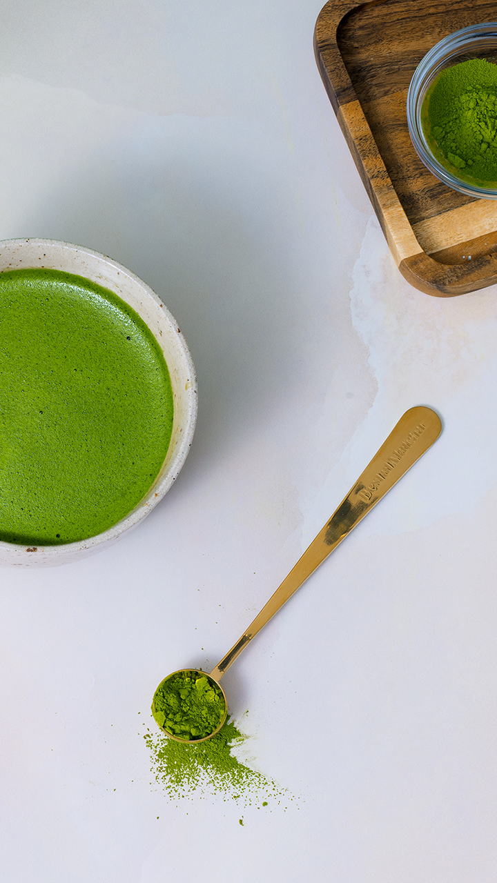 Freshly whisked ceremonial grade matcha in a ceramic chawan bowl with gold Best at Matcha perfect scoop and vibrant green matcha powder